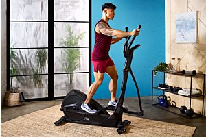 Man working out on JTX Strider-X8 cross trainer