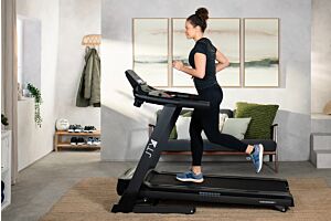 Woman running on JTX Sprint 7 treadmill