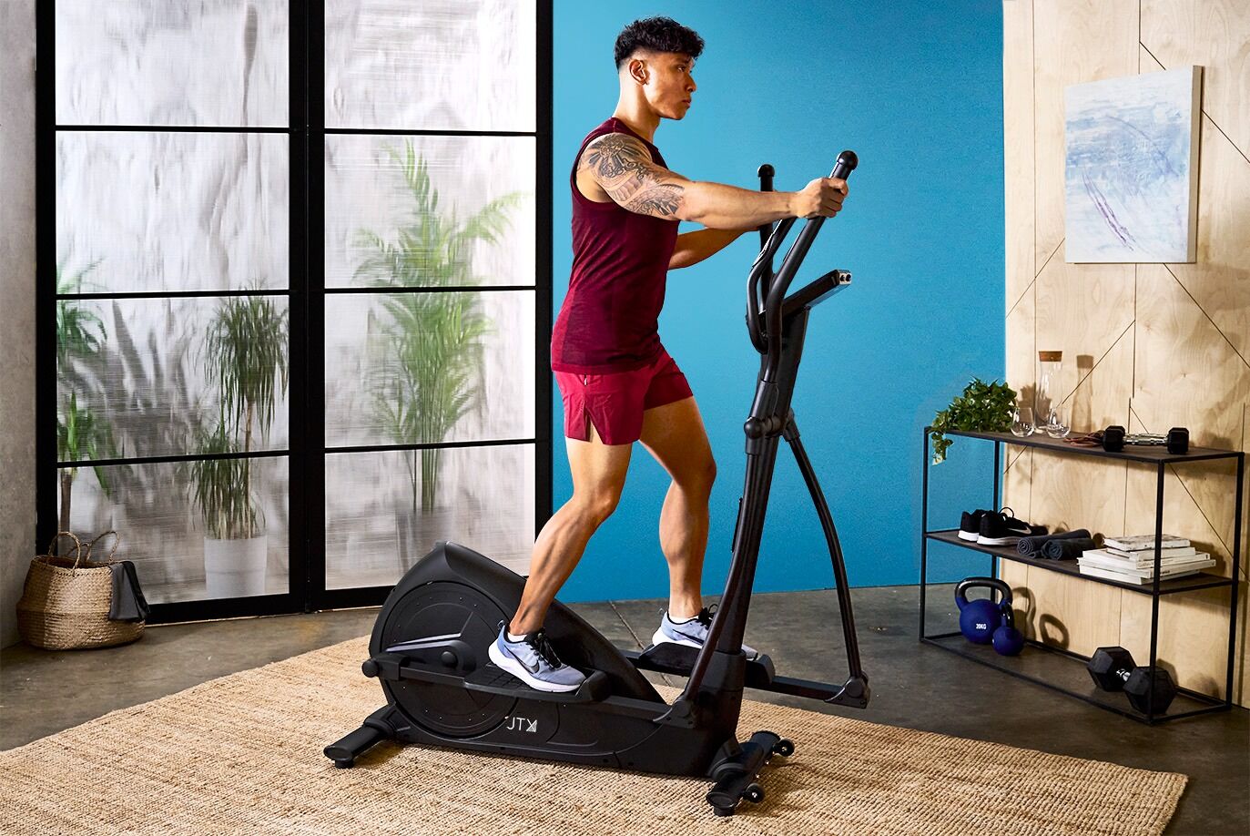 Man working out on JTX Strider-X8 cross trainer