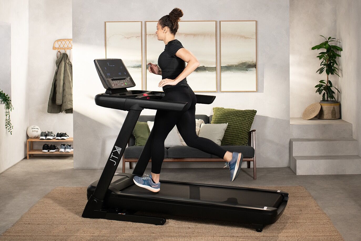 Woman running on JTX Sprint 8 Treadmill