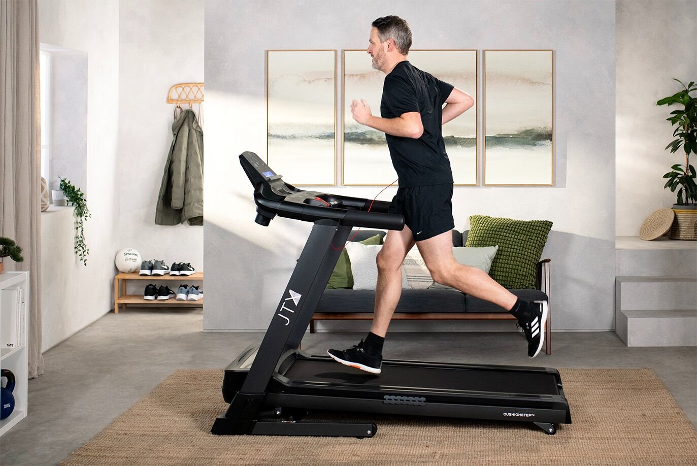 Man running on JTX Sprint 7 Treadmill