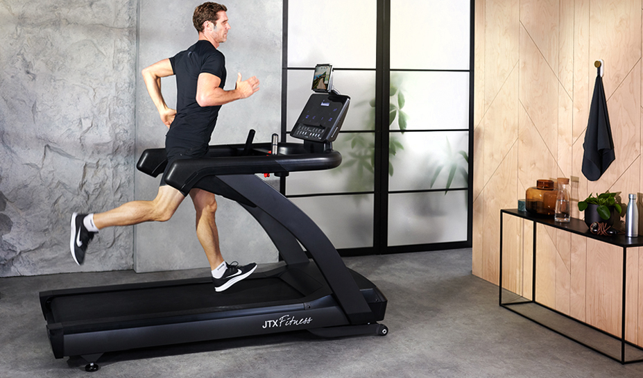 Man Using JTX Club Pro Treadmill