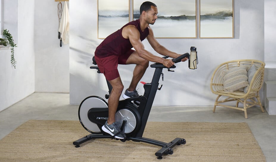 Man Using JTX Club Pro Treadmill